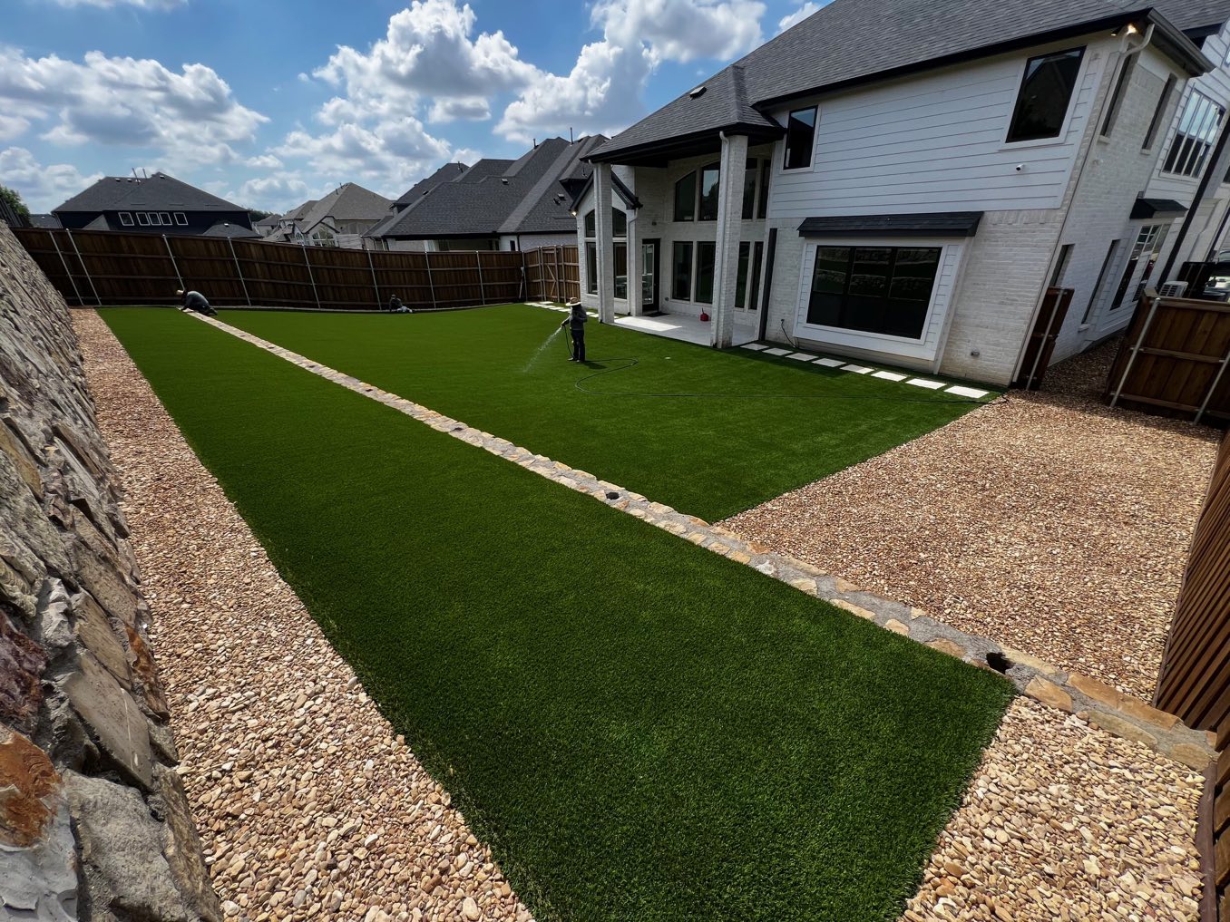 After: a long, narrow backyard strip behind a two-story house